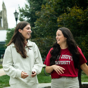 Two female students walking outside at Saint Joseph's University