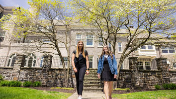 Students walking outside of Maguire Wolfington Welcome Center at Saint Joseph's University