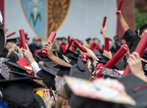 Saint Joseph's University students cheering during the 2023 Commencement ceremony.
