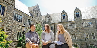 Saint Joseph's students sitting in Barbelin quad