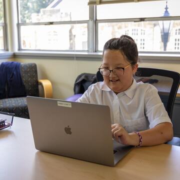 student working at a desk
