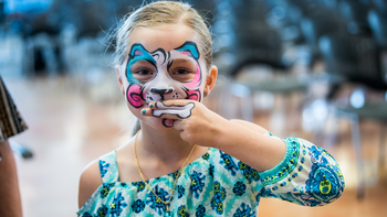 Girl with face paint at Camp Kinney