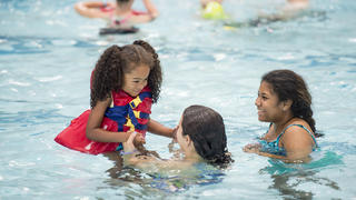 Little girl happy at swim lessons