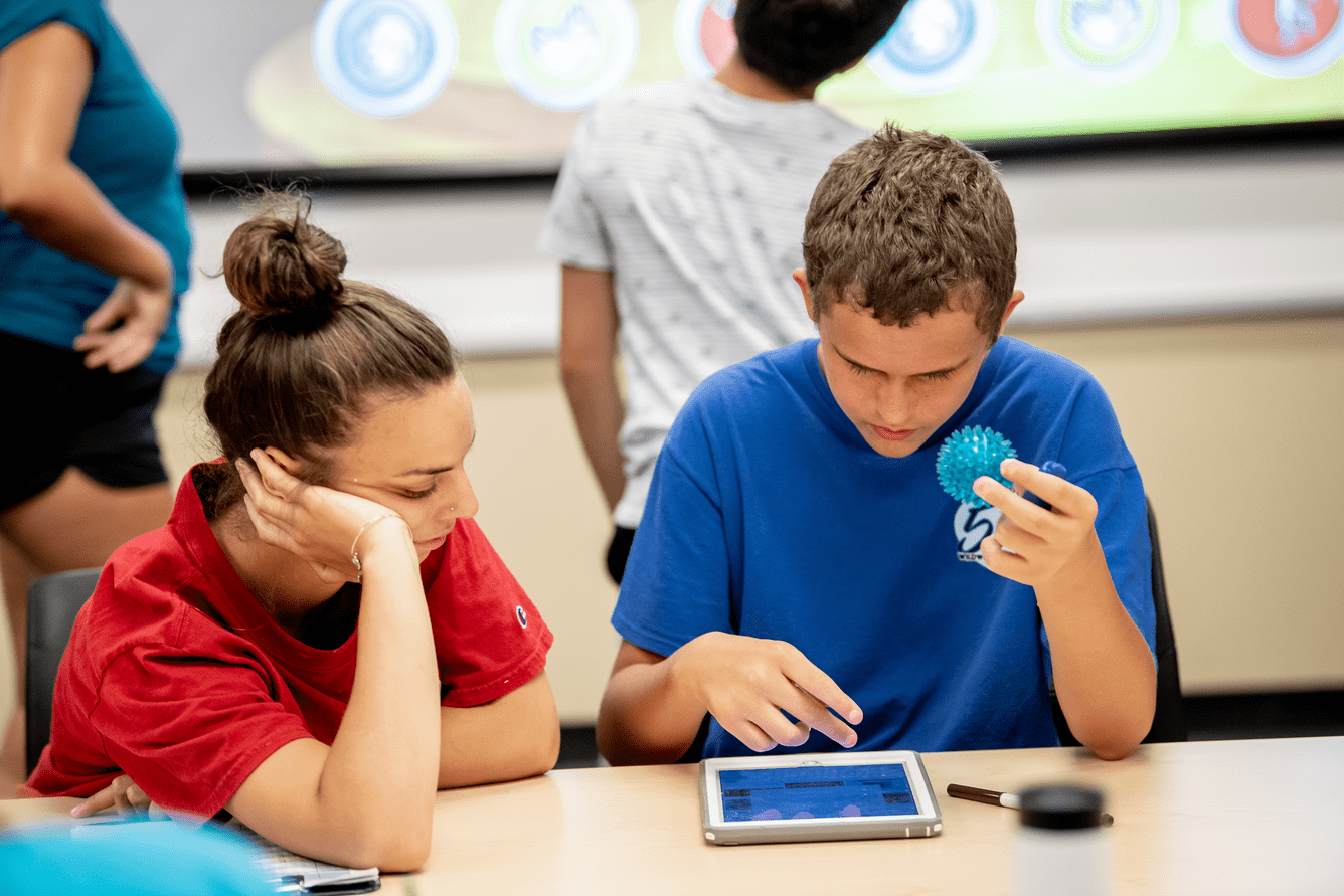 Counselor with student and Ipad