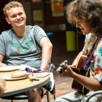 ASPIRE Student playing Guitar