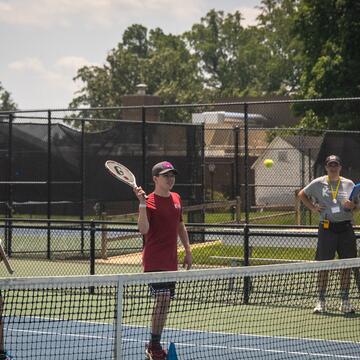 camper playing tennis