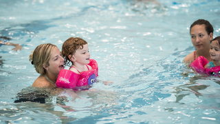 Group swimming at Camp Kinney