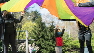 Students playing with Kinney staff.