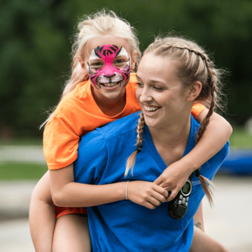 Student and girl with face paint