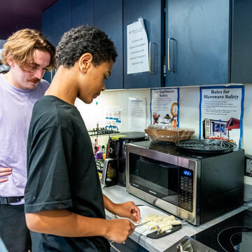 transitional client cutting fruit