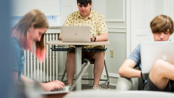 students working with laptops