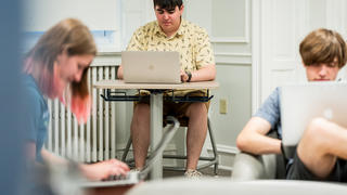 students working with laptops