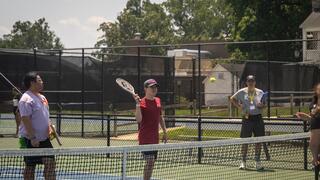 camper playing tennis