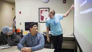 Liz Knezetic teaching a teenage boy