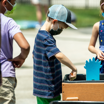 Boy playing outdoors in sandbox