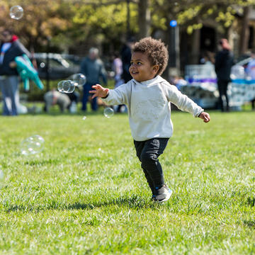 boy playing with bubbles