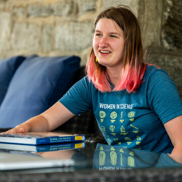 student sitting on patio