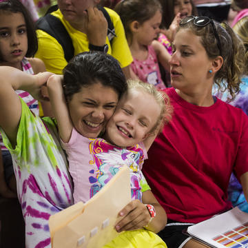 Child and SCHOLAR student at Camp Kinney