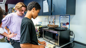 adult cutting vegetables