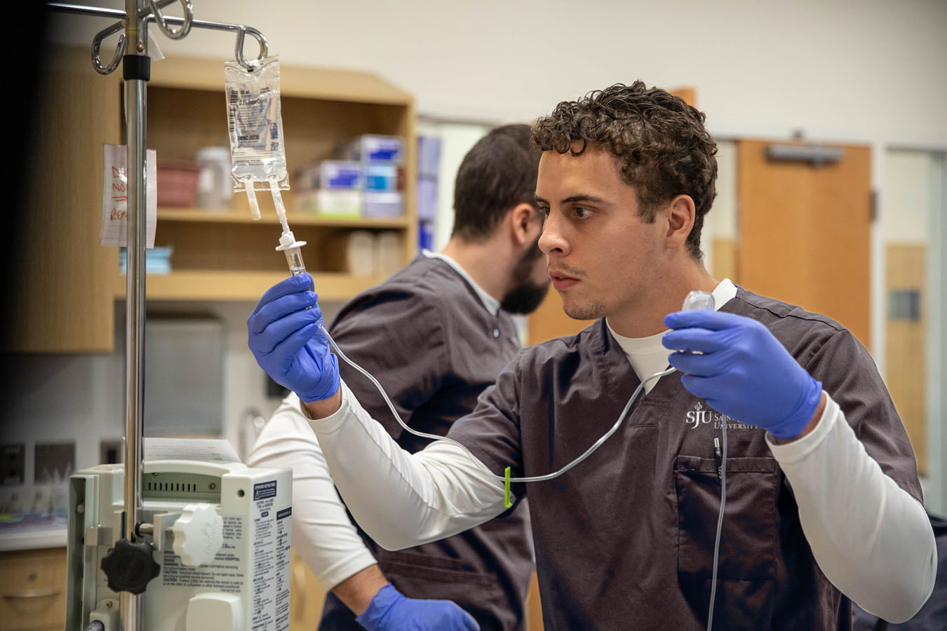 Intensive care Unit teaching room with students participating in real life scenario teaching for Saint Joseph's University in Lancaster 