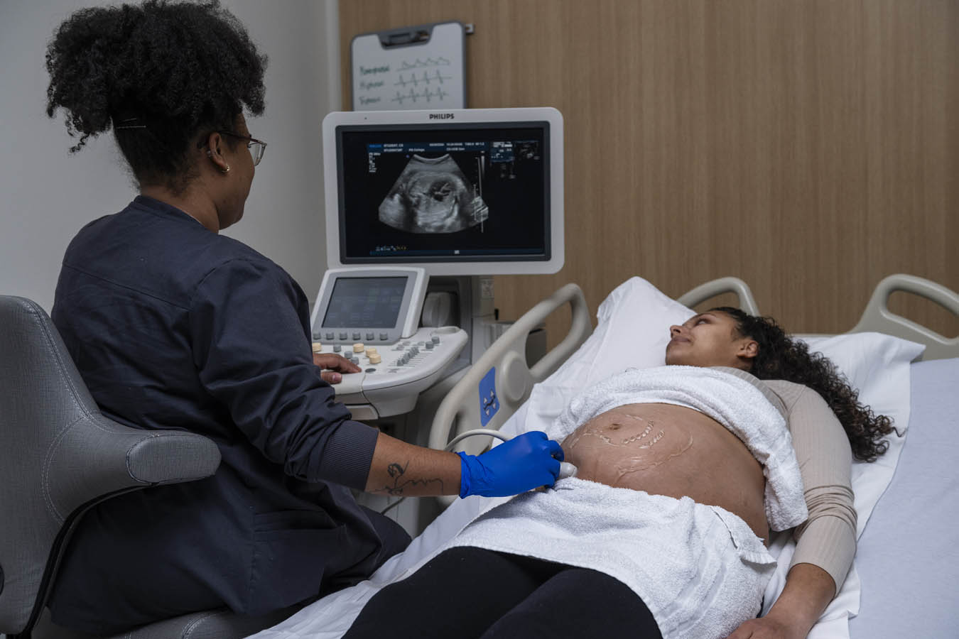 Saint Joseph's University sonography students performing a sonography on a practice patient