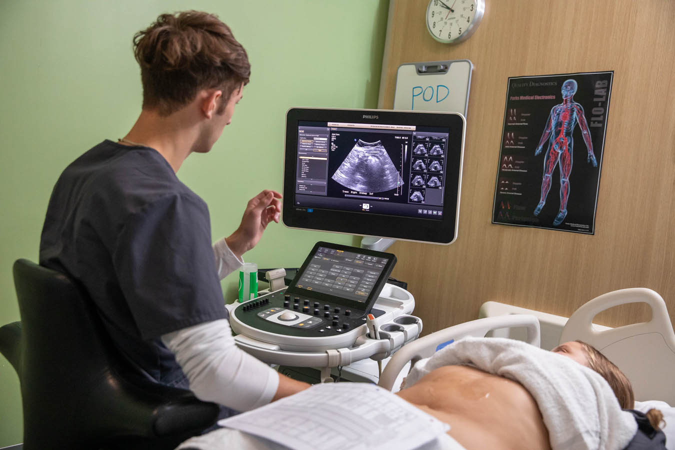 Saint Joseph's University sonography student performing a sonography test on a patient