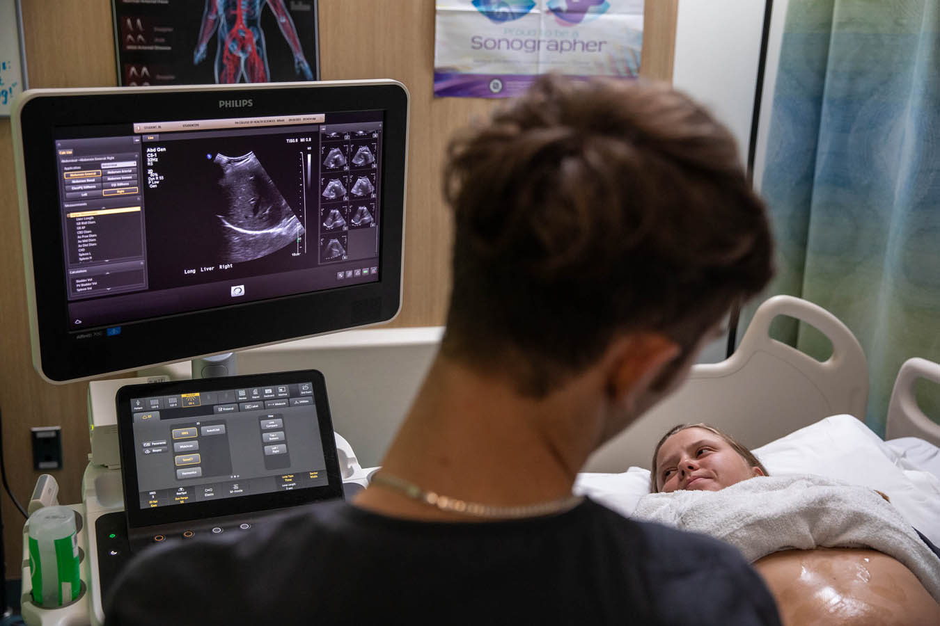 Saint Joseph's University sonography student performing a sonography test on a patient