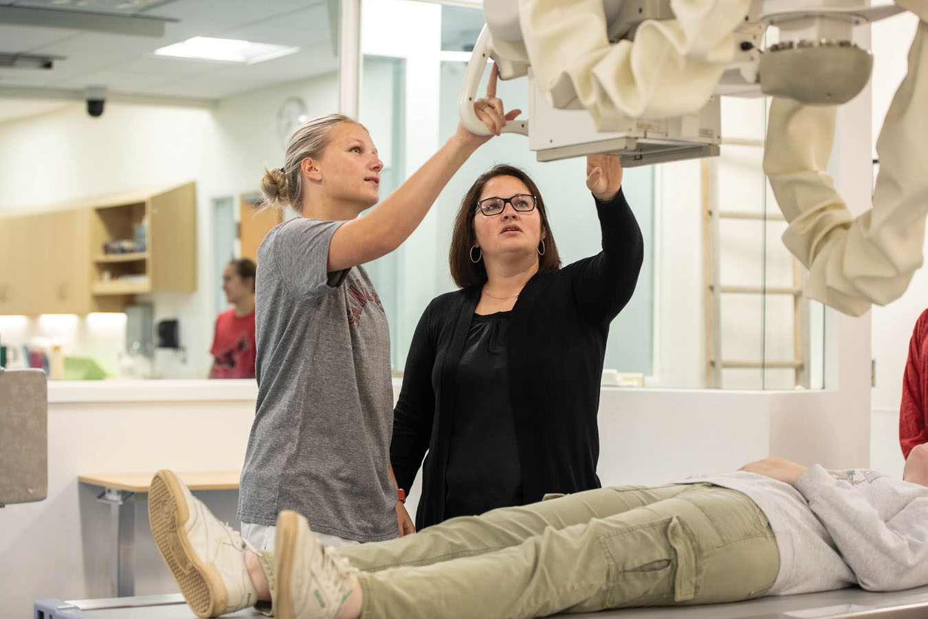 Saint Joseph's University students practicing taking x-rays on patients