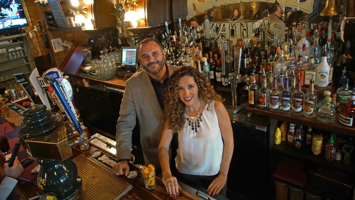 Gianmarco and Gilda behind the bar