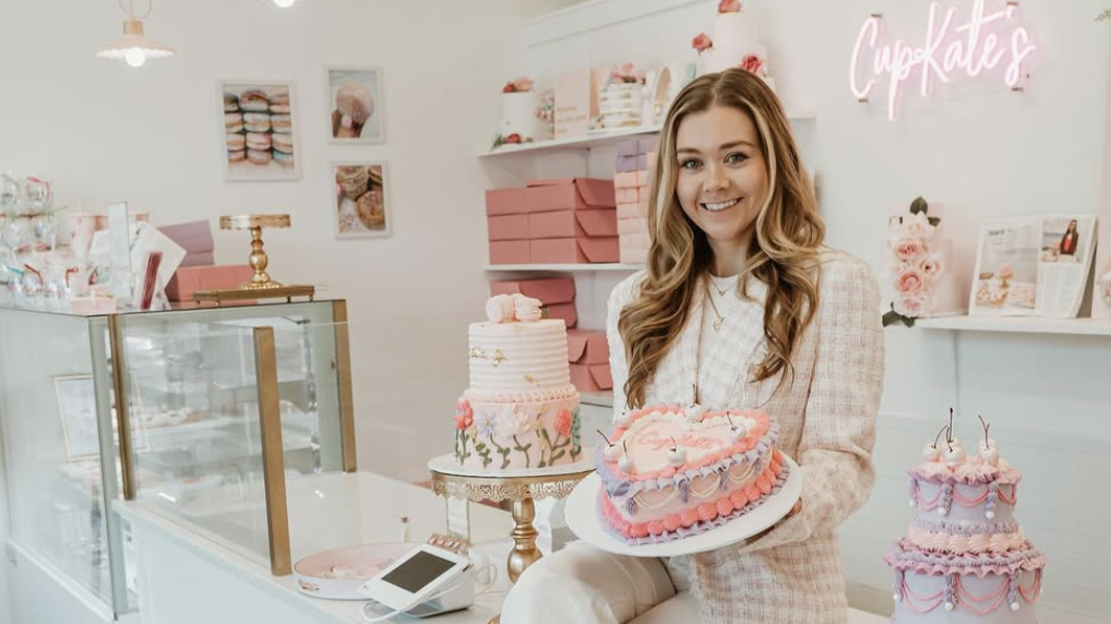 Female bakery owner inside store