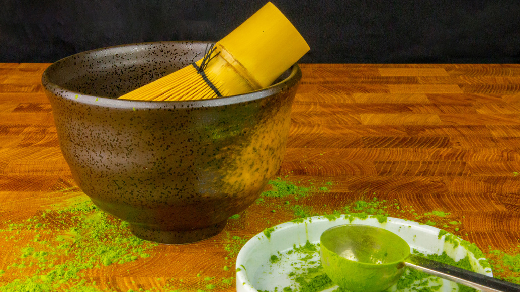 a bowl of ground matcha powder
