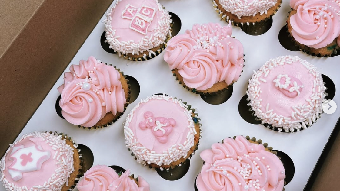 Box of pink-frosted cupcakes