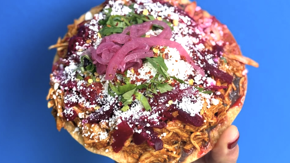 A tostada with various ingredients