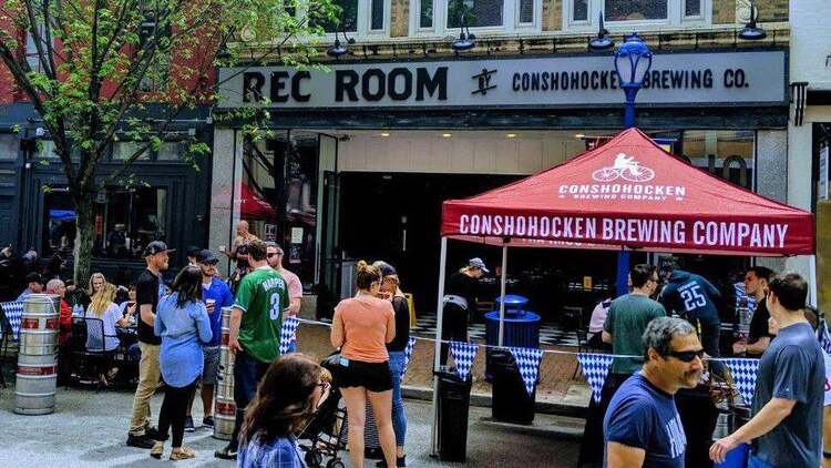 people mingling outside of Conshohocken Brewing Company 
