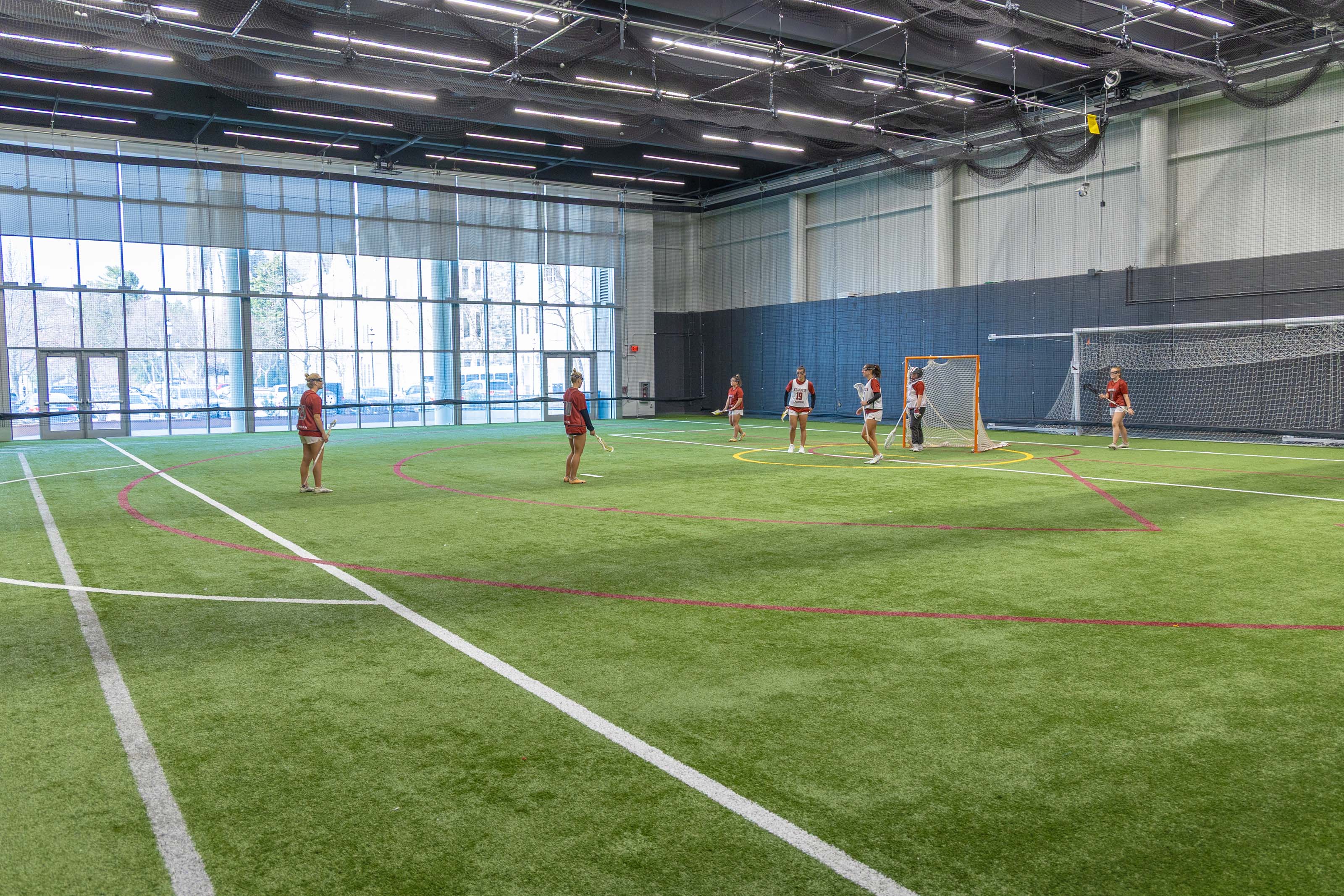 Maguire Athletic Center turf field with student athletes practicing