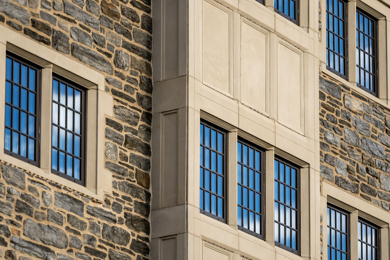 Detail of the side of a stone building with multiple windows