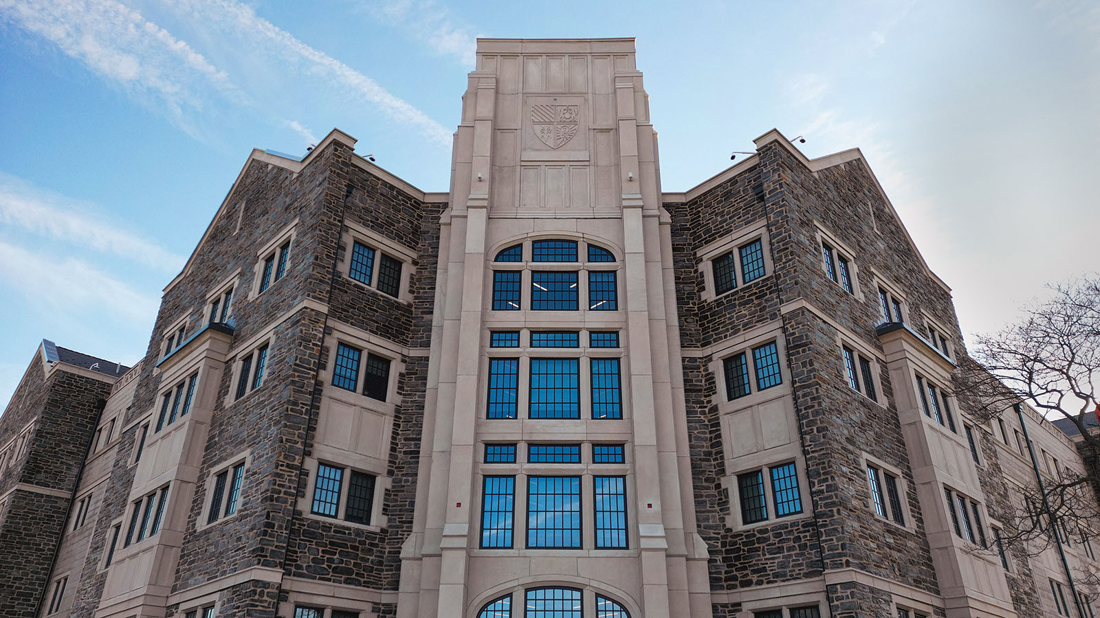 A large stone building with glass windows