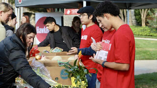 Students pick out produce at a free Trader Joe’s pop-up sponsored by Saint Joseph's HawkHUB