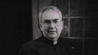 Nicholas S. Rashford, S.J. wearing his cassock