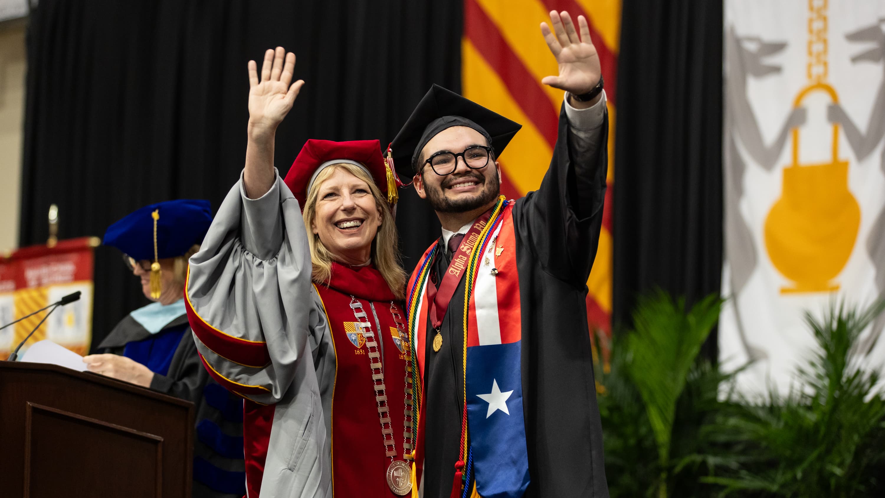 Male student with Saint Joseph's president at commencement