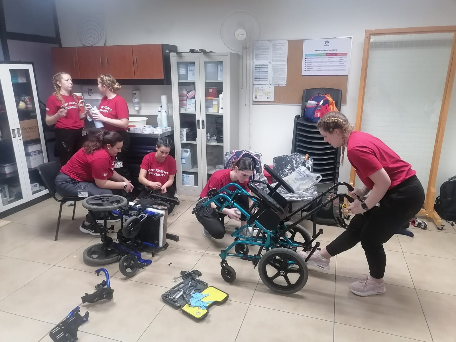 Students working on wheelchair adjustments