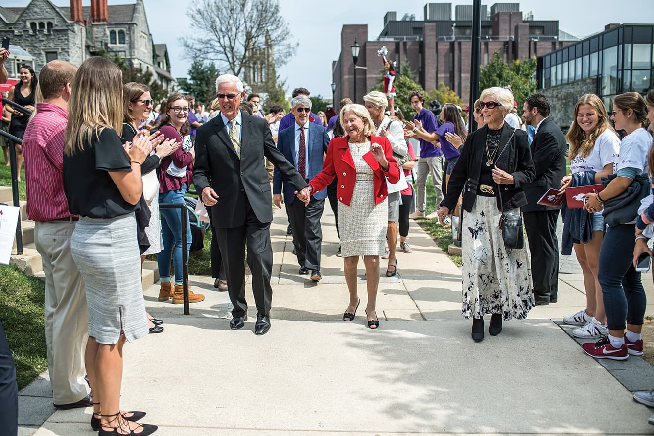 The Maguires walking outside during honorable celebration