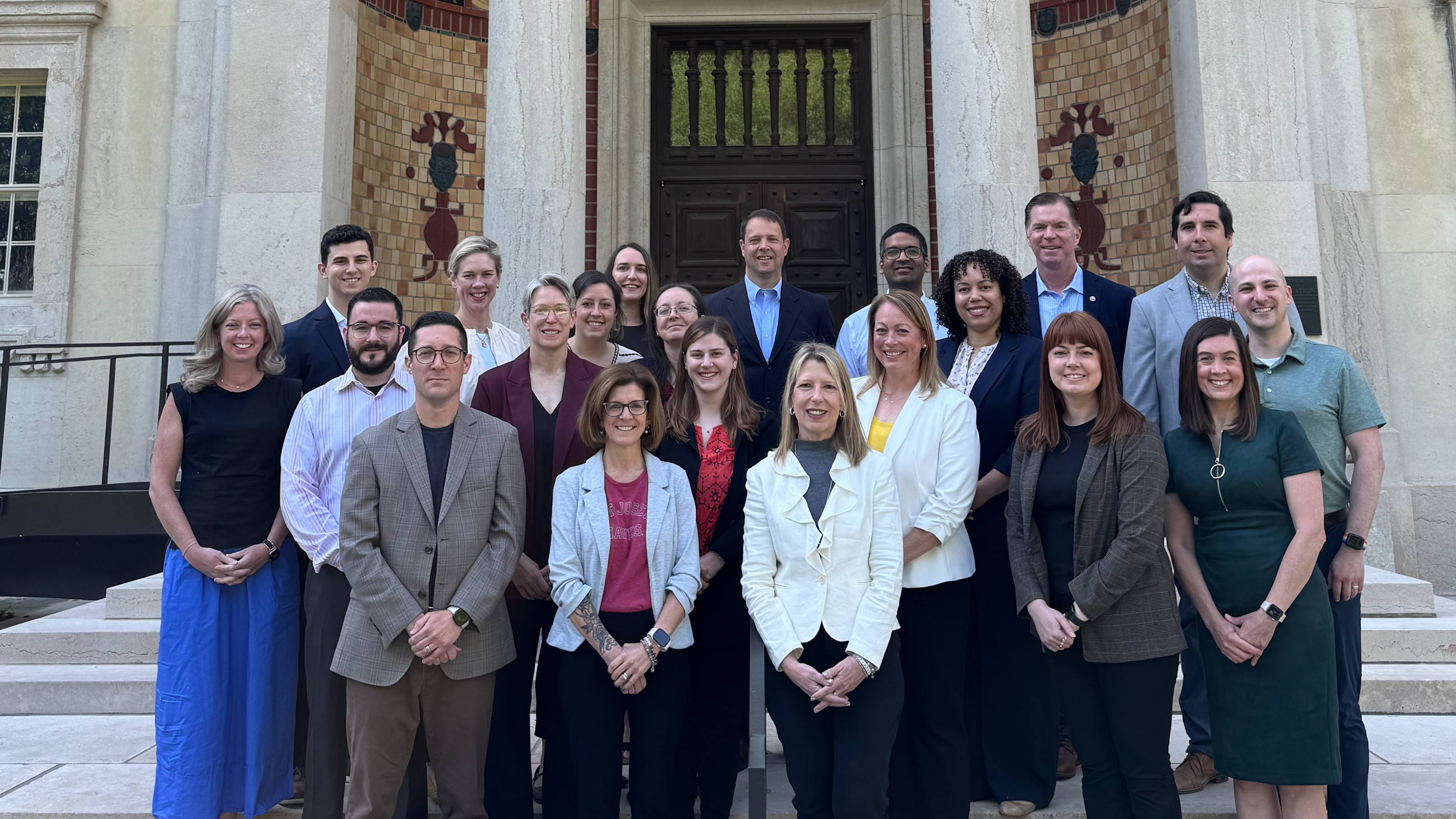 Participants in the inaugural Self-Aware Leader (SAL) program gather with President Cheryl A. McConnell, PhD, in front of the Frances M. Maguire Art Museum following their final project presentations on May 19, 2025.