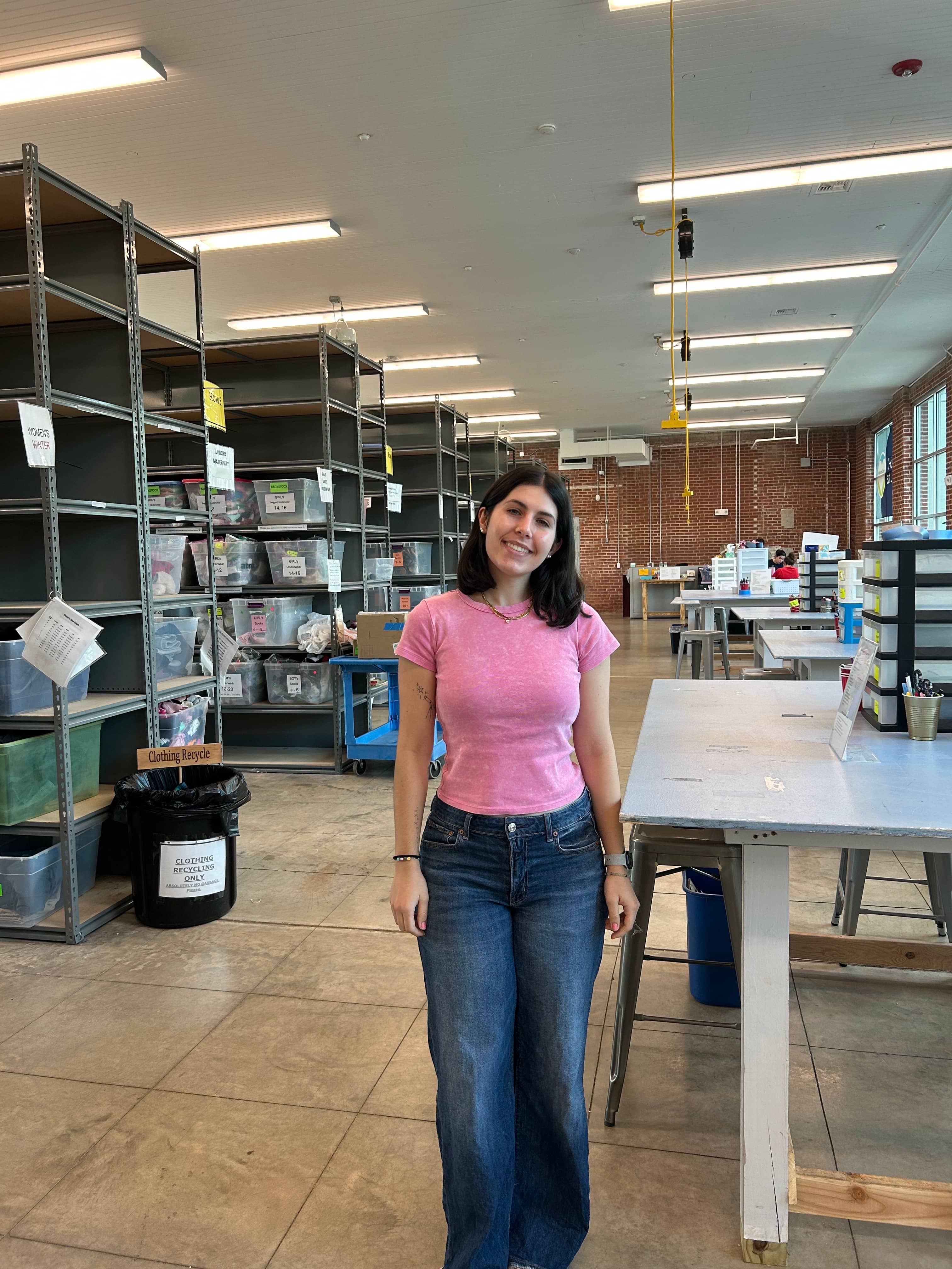 A photo of Cara in the warehouse at her internship