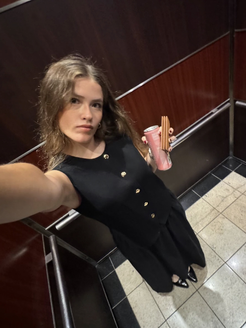 Mariana taking a selfie in an elevator