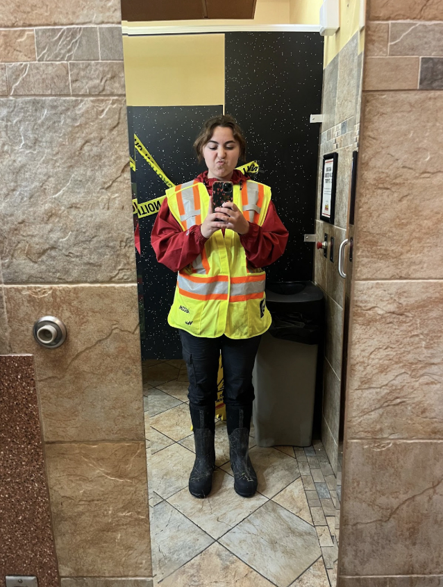 Nicole taking a mirror selfie wearing environmental science jersey