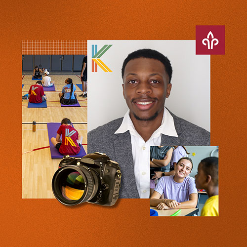 A man smiling with a camera next to him