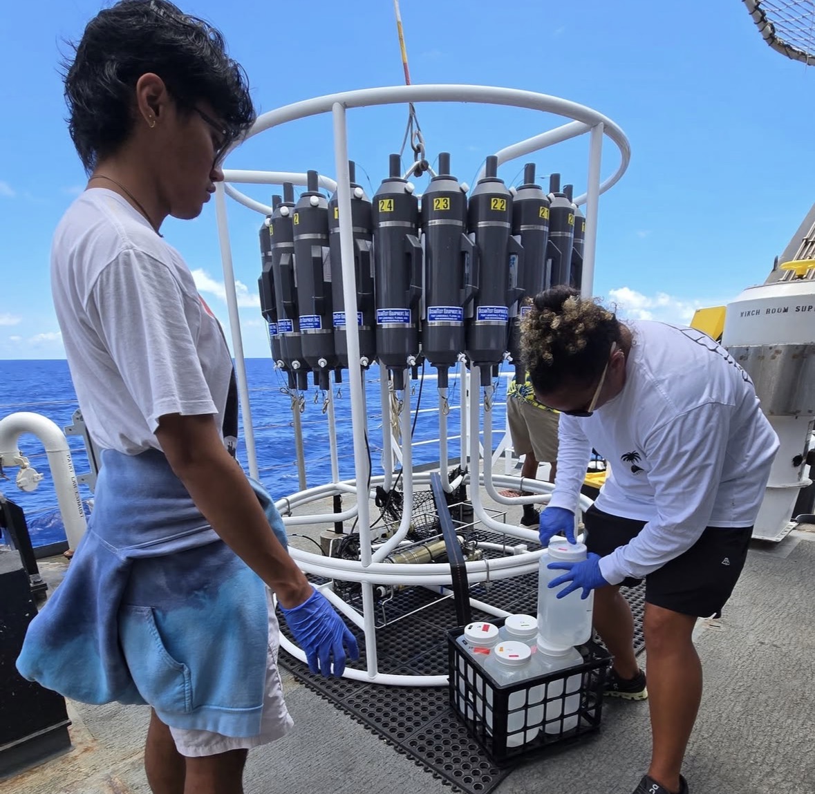 Sean looking at a large machine collecting water samples