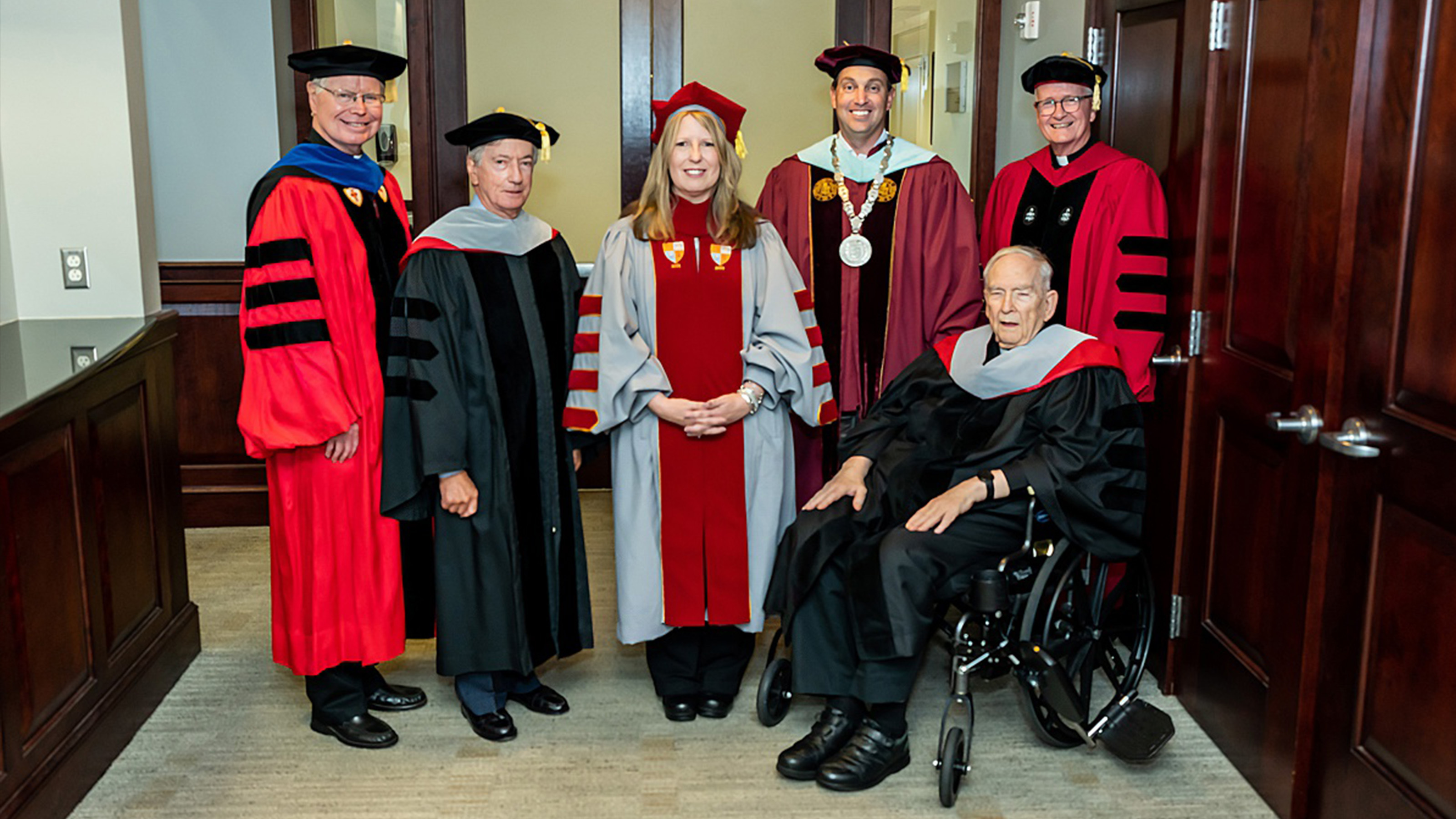 Dr. McConnell stands next to former Saint Joseph's presidents. 