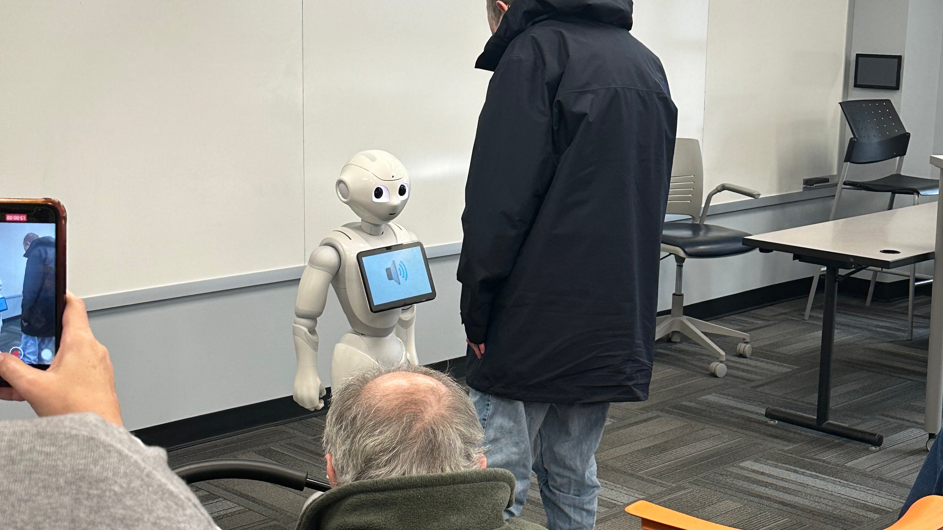Bancroft residents interacting with Iggy during a visit to the Haub Innovation Center on Dec. 8.